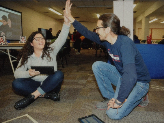 students hi-fiving